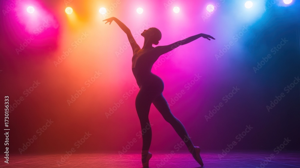 Fototapeta premium Ethereal ballerina silhouette poised gracefully under vibrant stage lights