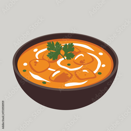 Curry in a bowl, topped with white cream and green garnish