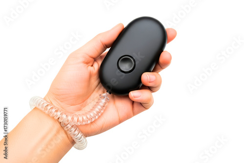 Wallpaper Mural Hand holding a black personal safety alarm with a wrist strap on a transparent background Torontodigital.ca