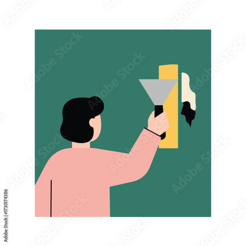 Man smoothing over green wall section with putty knife, yellow section behind