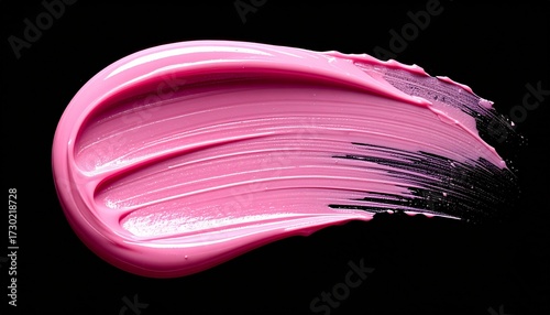 A vibrant pink lipstick or cosmetic cream smear showing its glossy texture on a solid black background.