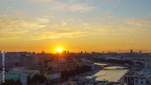 Aerial timelapse of Moscow at sunset with the Kremlin, Zaryadye Park and river reflecting colorful sky