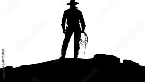 Silhouette of a Cowboy Holding a Lasso in the Desert Landscape