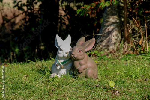 A Pair of Old Rabbit Statues Situated in a Country Park