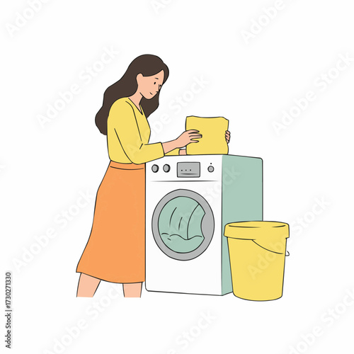 Woman doing laundry by loading clothes into washing machine  