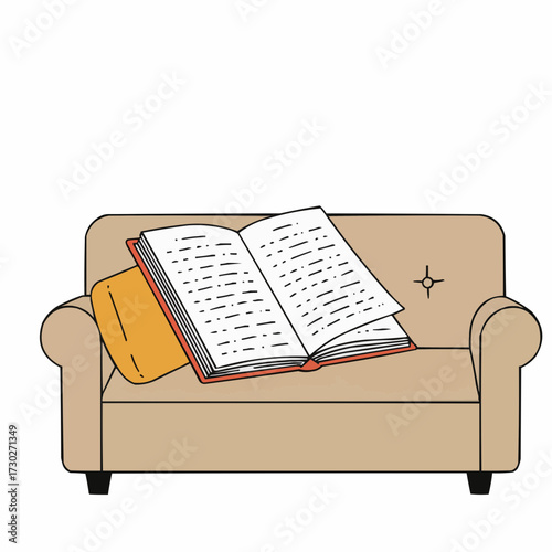 Open book resting on cozy sofa in neutral colors  