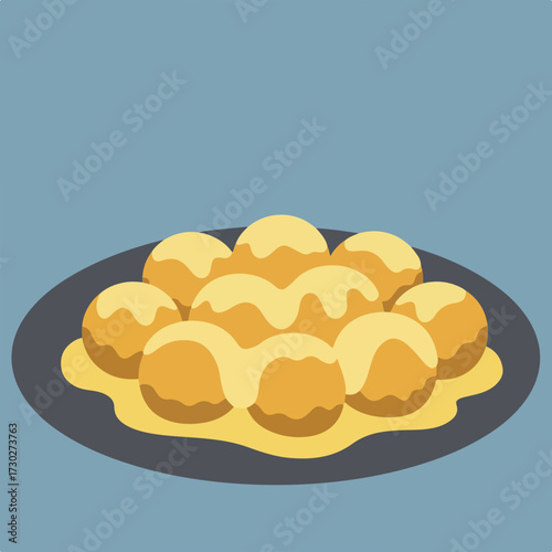 Plate of drizzled golden dumplings against a blue background