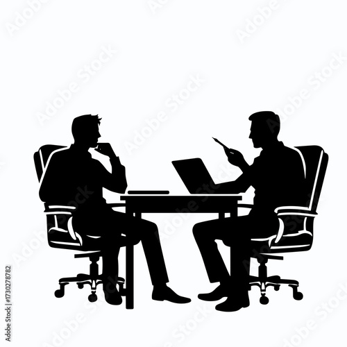 Two business men discussing strategy at a conference table  