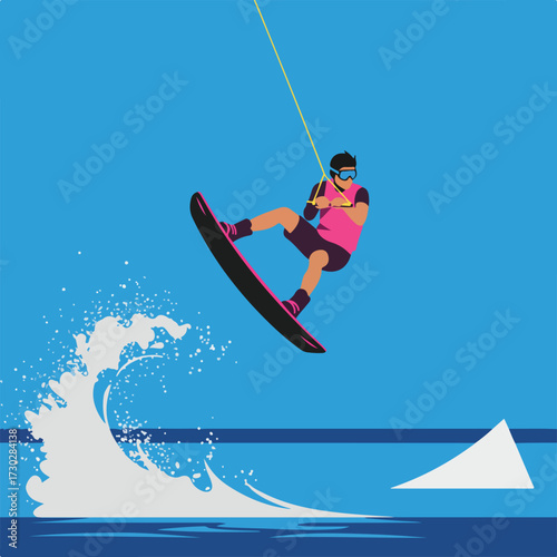 Wakeboarder performs a trick near a wave, with jump ramp in blue graphic