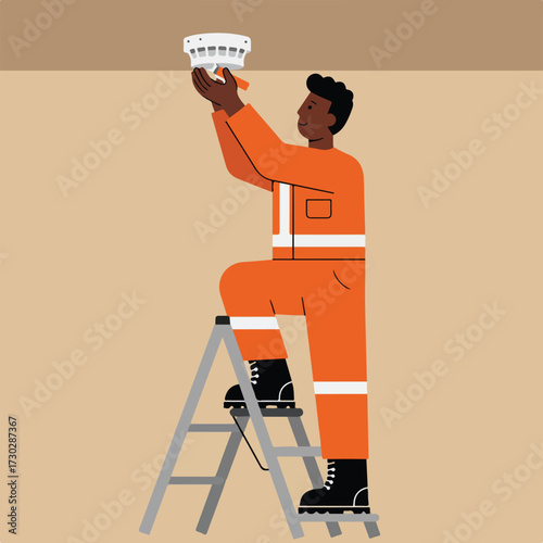 Technician on ladder installing smoke detector