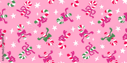 Whimsical pink candy cane seamless background. Сute Christmas lollipops with bows, stars, festive winter wrapping paper vector
