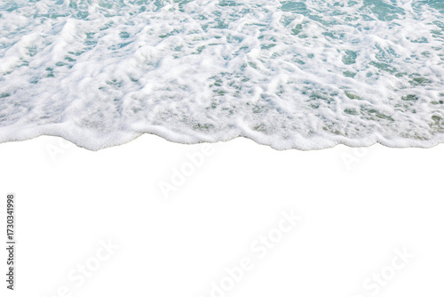 Ocean waves gently wash over sandy beach, creating soothing and tranquil scene