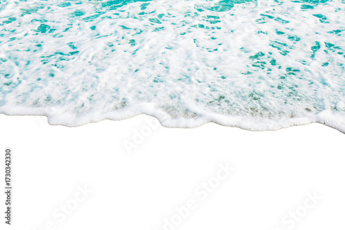 Aerial view of ocean waves gently crashing onto sandy beach, creating soothing and tranquil scene