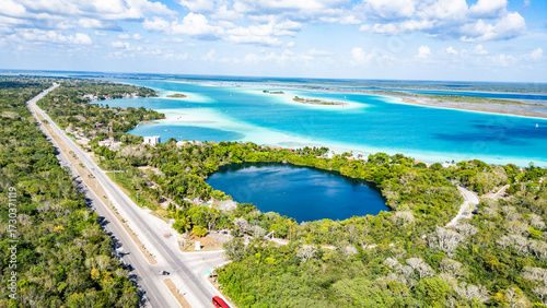 Bacalar, Mexico, Quintana Roo, Beautiful lake surrounded by trees and a road