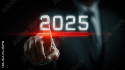 Man in Suit Touches Glowing 2025 Number with Red Highlight Line