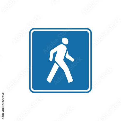 Pedestrian walks across blue crosswalk sign indicating safe passage for people on foot, symbolizing safety and accessibility in urban environment.