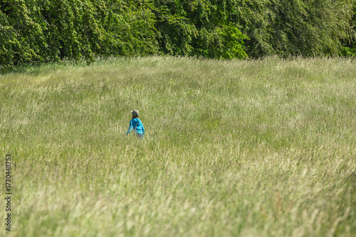 Girl running and jumping in a field