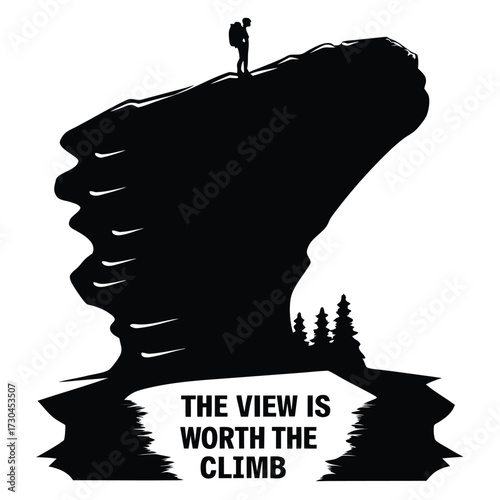 Black and white image of a mountain climber at a mountain peak