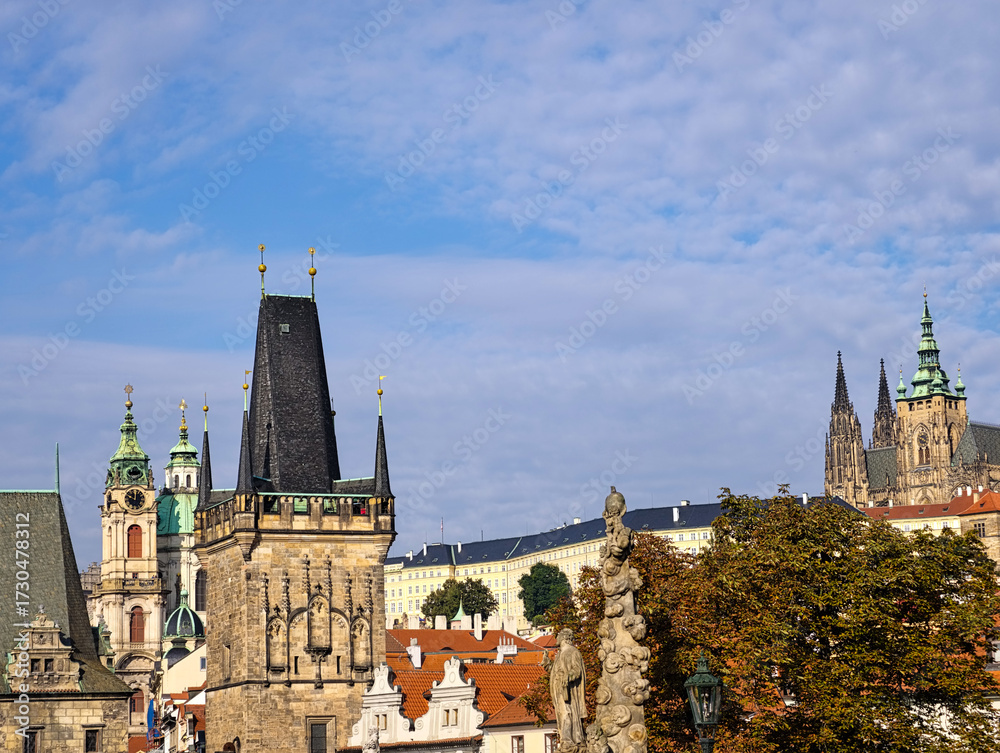 Fototapeta premium Prague Charles Bridge Gothic Tower with View of St Nicholas Church Dome and Baroque Architecture in Historic Czech Republic. Natural Background 