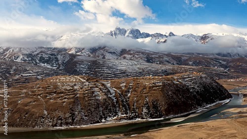 Time-lapse aerial view of snow-capped mountains and rivers in Ganzi County, Sichuan Province