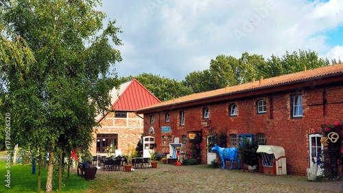 The typical red brick and wood architecture in the tourist area of ​​Cape Arkona, on the island of Rügen, Germany. The old farmhouses have now been converted into shops and restaurants.