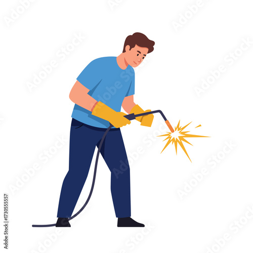 Man welding with protective gloves, creating sparks. He is wearing a blue t-shirt and dark pants.
