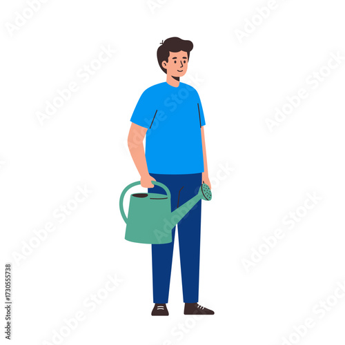 A man in blue holds a watering can, ready to tend to plants.