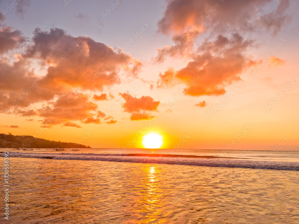 Fototapeta premium Sunset over the ocean in Jimbaran beach, Bali, Indonesia