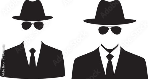 Two men in suits hats and sunglasses silhouette
