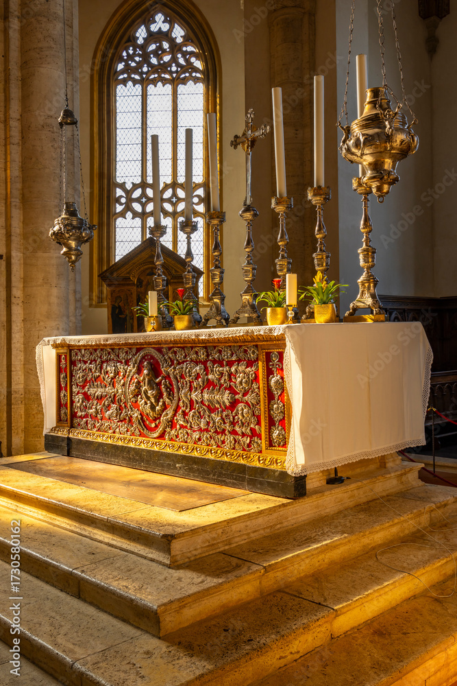 Fototapeta premium Ornate church altar displaying religious artifacts in Pienza