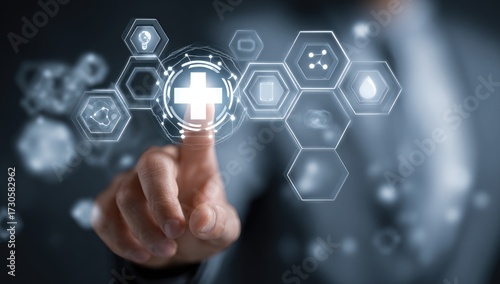 A finger points to a central cross within a network of glowing hexagonal icons, representing healthcare technology and digital innovation