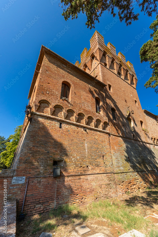Obraz premium Ancient brick building showing architectural details at Monte Oliveto Maggiore