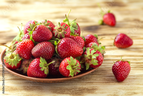 Fresh Strawberry in Ceramic Plate on a Rustic Table as Food Background
