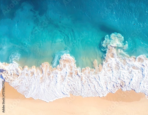 Aerial View of Ocean Waves Crashing on Sandy Beach