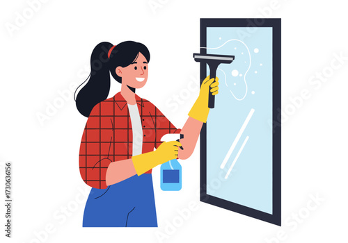 Woman cleaning a window with a squeegee and spray bottle