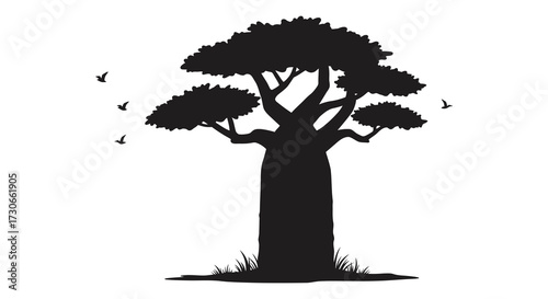 A solitary baobab tree with flying birds a striking silhouette