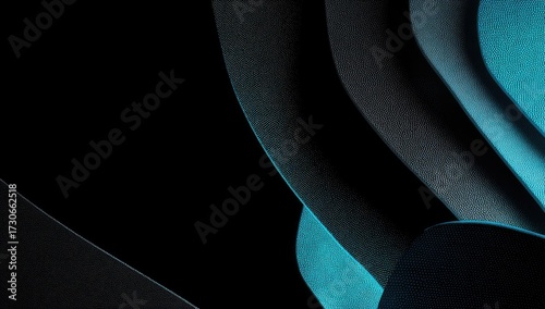 Intricate, layered shapes in deep teal and charcoal create a dynamic abstract design.