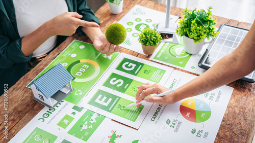 Tableau sur toile Business executives discuss environmental sustainability ESG reports for corpora