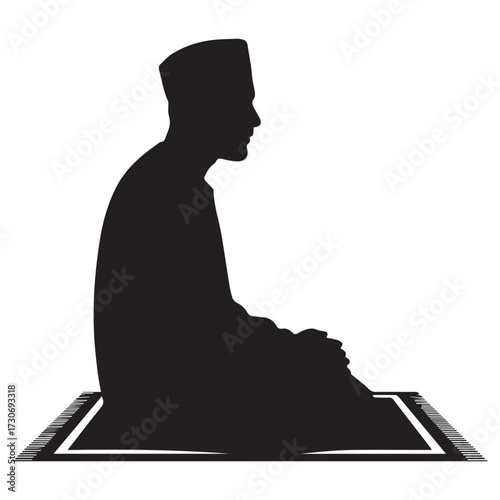 Silhouette of a muslim man wearing a kufi cap and traditional clothing praying on a prayer mat in profile view against a white background