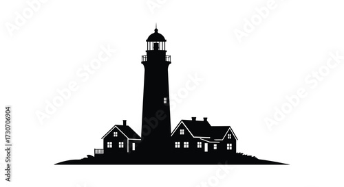 Coastal lighthouse and houses stand dark against a bright background silhouette