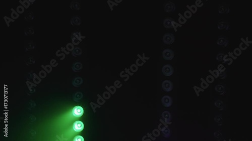 Vibrant RGB stage lights casting dynamic beams in multiple colors, creating an electrifying atmosphere perfect for concerts, festivals, and night events with immersive illumination.