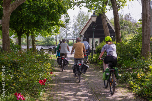 Cyclists on their way to the bicycle ferry across the river Vecht between the village of Nigtevecht and Nederhorst den Berg.
