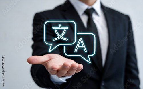 Businessman Holding a Holographic Language Translation Icon for Global Business Communication