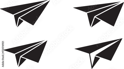 Four Black Paper Airplanes in Different Orientations origami flight