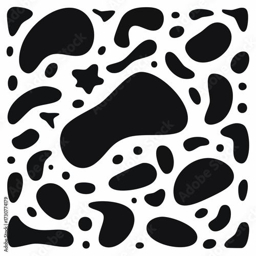 Abstract black shapes scattered on a white background, creating a visually interesting pattern.