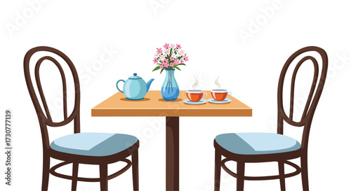A small table set for two with tea and flowers.