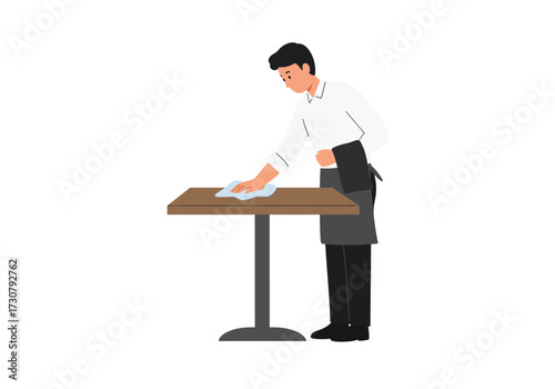 A server in uniform cleans a brown table with a blue cloth