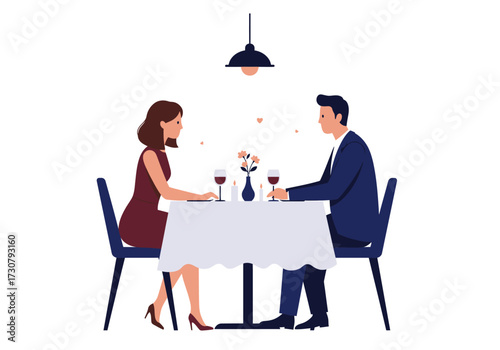 Couple at dinner table under a hanging light with wine candles and a flower vase