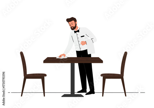 Server cleans a restaurant table between chairs setting the stage for the next guests