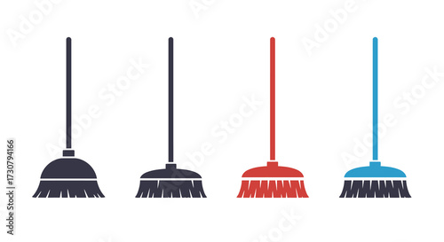 Four colorful cleaning brooms stand in a simple linear arrangement